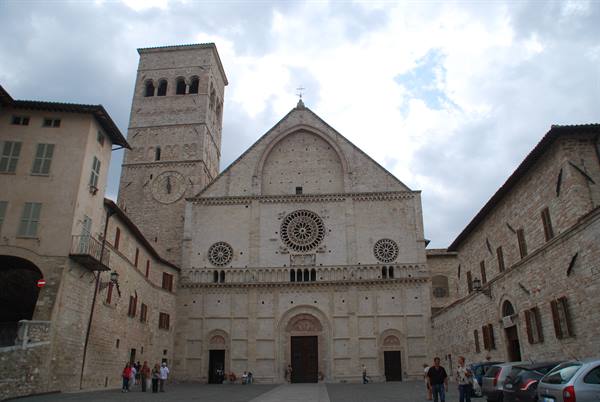 St Francis Basilica in Assisi with rose window and stone bell tower