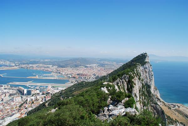 Rock of Gibraltar, green rocky ridge above the city and harbour