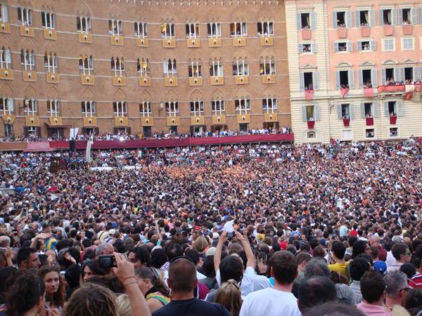 Huge crowd filling Piazza del Campo in Siena during the Palio