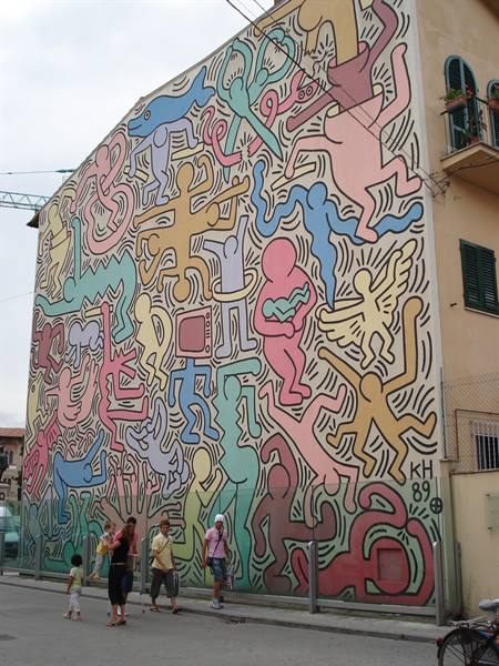 Keith Haring's 1989 mural facade, pedestrians walking below
