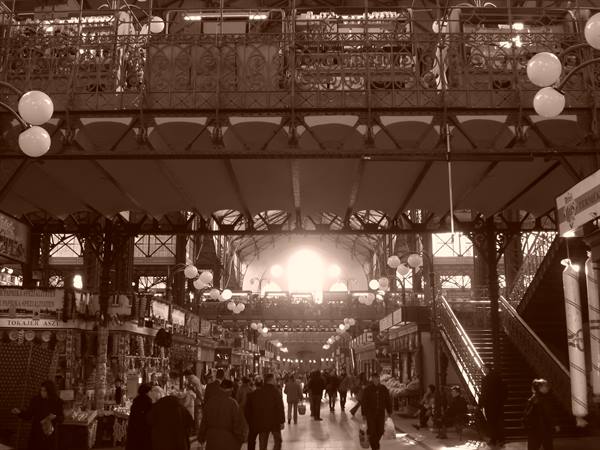 Budapest covered market hall: visitors browse stalls under the iron structure