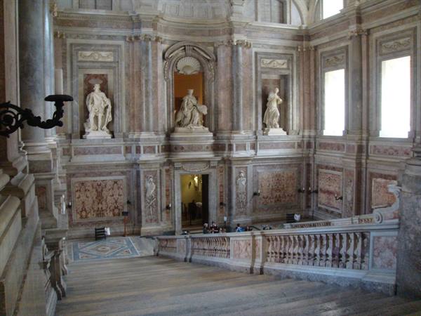 Marble grand staircase with statues, Royal Palace of Caserta, window light