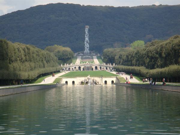 Caserta Royal Palace: long water basin, fountains and tree-lined avenues below the hill