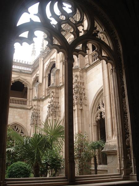 Gothic cloister of San Juan de los Reyes in Toledo through ornate window