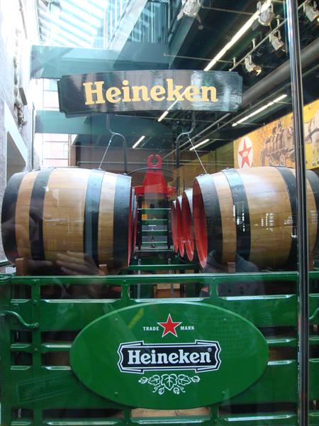 Wooden barrels on green Heineken wagon, Heineken Experience in Amsterdam