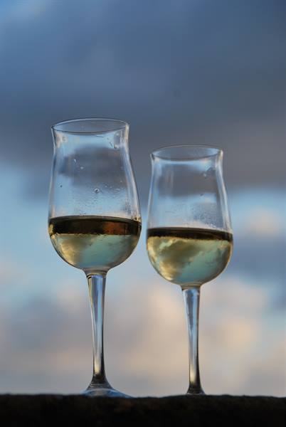 Two glasses of white wine against a cloudy sky, Montepulciano