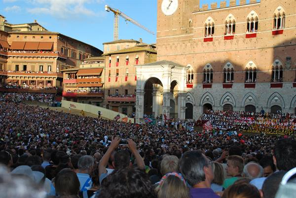 Crowd at Palio horse race in Siena's Piazza del Campo, Torre del Mangia