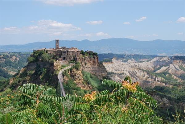 Civita di Bagnoregio: medieval village on tuff hill, footbridge, eroded badlands below