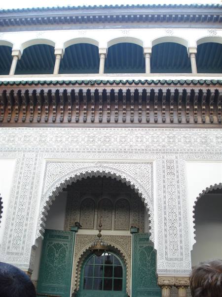 Carved arch and green doors in the Fez medina