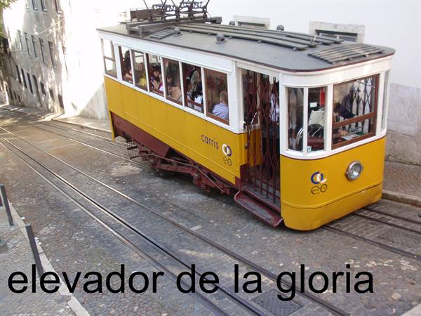 Yellow Carris tram climbing the tracks of Elevador da Glória in Lisbon