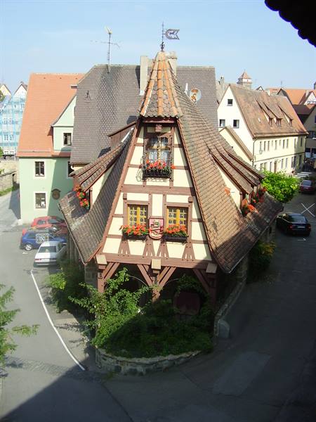 Half-timbered house with pointed roofs and flower boxes, Rothenburg ob der Tauber