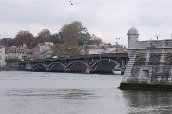 Arched stone bridge over the Adour river, Bayonne