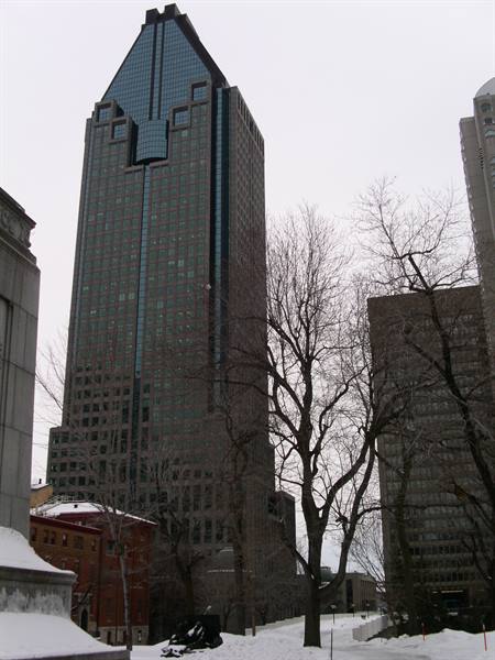 1000 de La Gauchetière skyscraper in Montreal among bare trees and snow
