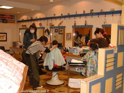 kids' hairdresser...they watched doraemon sitting on little rides