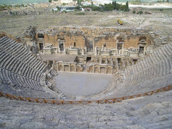 Ancient theatre of Hierapolis, marble seating and stone stage wall in daylight