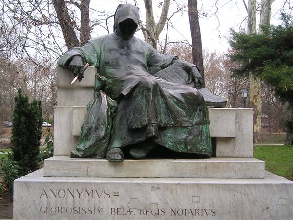 Bronze statue of hooded Anonymus, seated notary in Városliget park, Budapest