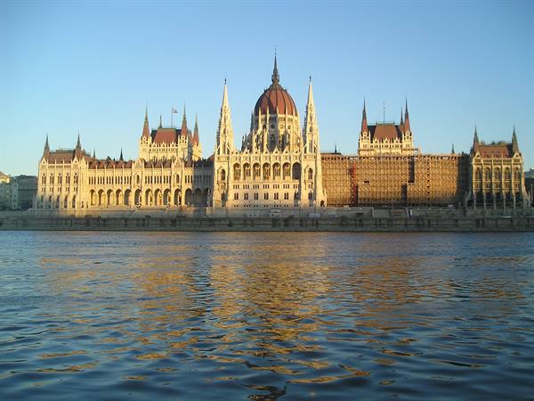 Budapest Parliament reflecting in the Danube under a blue sky