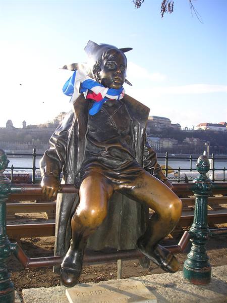 Little Princess bronze statue sitting on the railing, Budapest