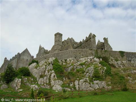 Medieval stone ruins on the Rock of Cashel beneath clouds