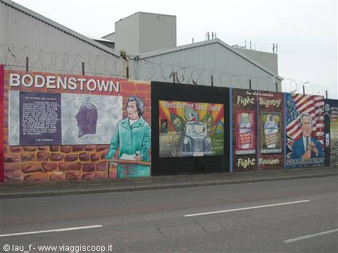 Belfast political murals: Pádraig Pearse portrait and barbed wire on city walls