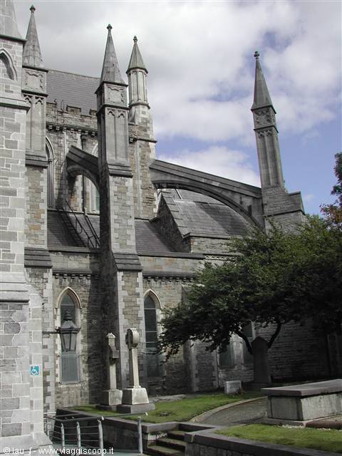 Flying buttresses and grey stone spires of St Patrick's Cathedral, Dublin