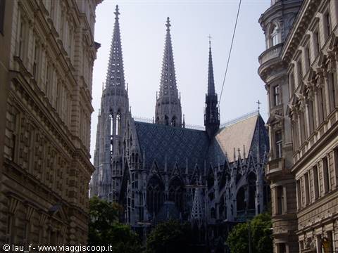 Gothic spires of the Votivkirche rising between historic Vienna buildings