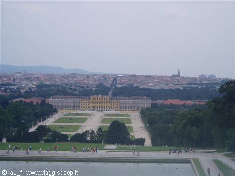 Schönbrunn Palace with symmetrical gardens visited by tourists, Vienna