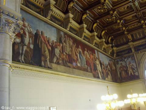 Historical fresco with horse and figures under gilded wooden ceiling