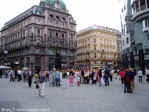 Tourists gathered in front of historic buildings in Vienna
