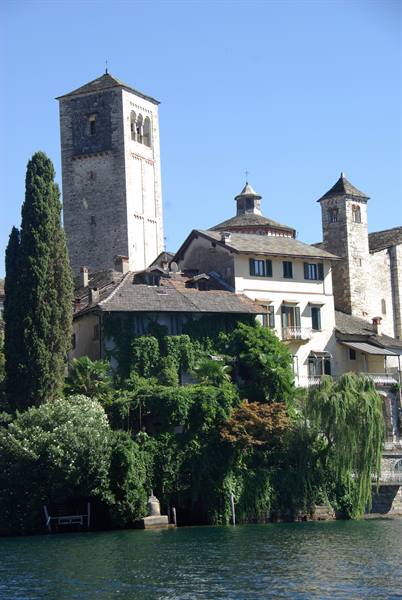 San Giulio Island: Romanesque bell tower and old houses by the lake