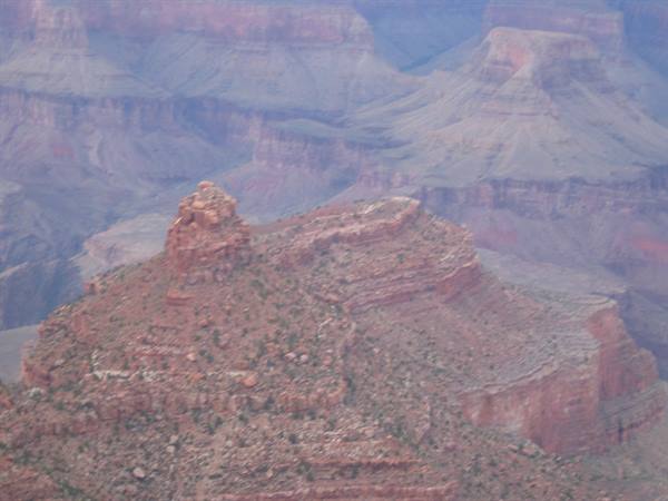 Red rock buttes of the Grand Canyon in haze