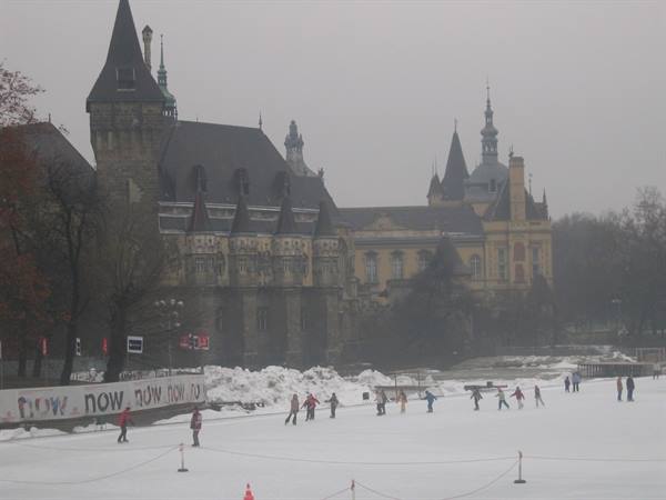 Skaters on the ice rink in front of Vajdahunyad Castle