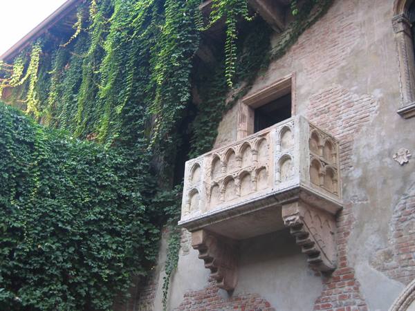 Juliet's balcony in Verona, gothic marble on ivy-covered walls
