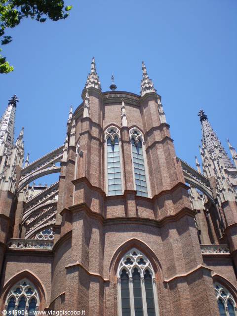 Neo-Gothic brick spires of La Plata Cathedral against a blue sky