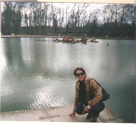 Woman crouching by the Apollo pond, Versailles
