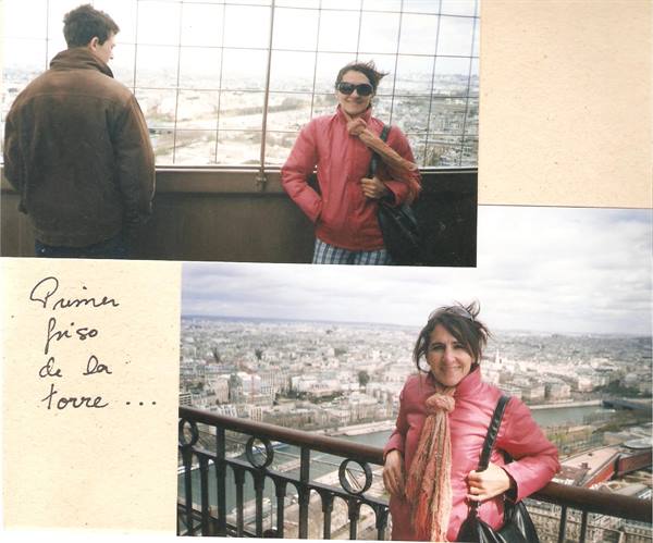 Tourists in pink jacket on the Eiffel Tower platform, Paris and the Seine below
