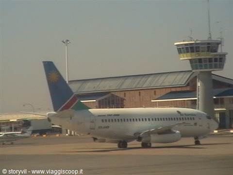 Air Namibia Boeing 737 taxiing past the control tower at Windhoek airport