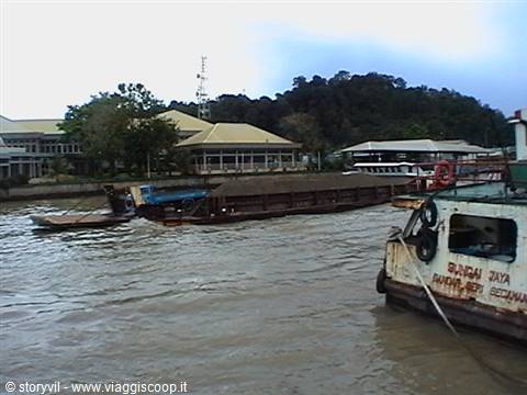 Barges loaded with materials along the river in Bandar Seri Begawan