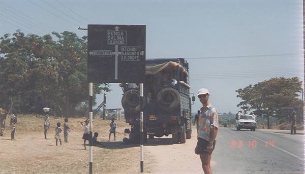 Man beside loaded truck at the junction to Salima and Lilongwe