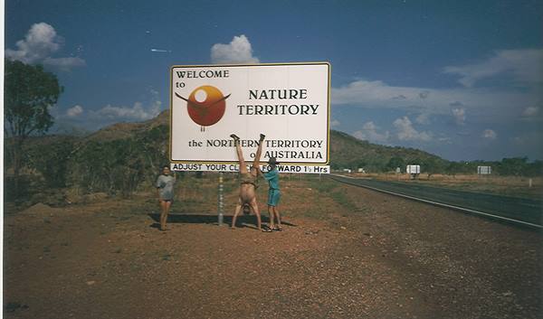 Tourists under the Welcome to Nature Territory sign, Northern Territory