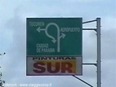 Green road sign in Panama City pointing to Tocumen and airport