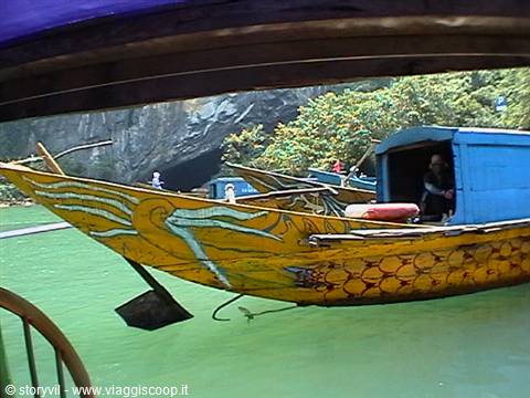 Wooden boat painted with golden dragon in Ha Long Bay