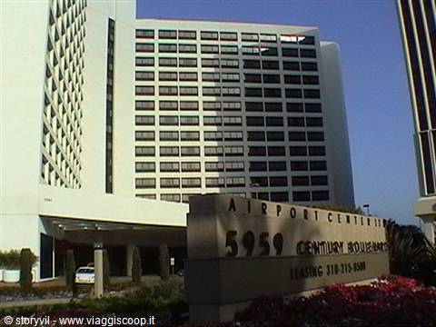 White high-rise with Airport Center sign at 5959 Century Boulevard