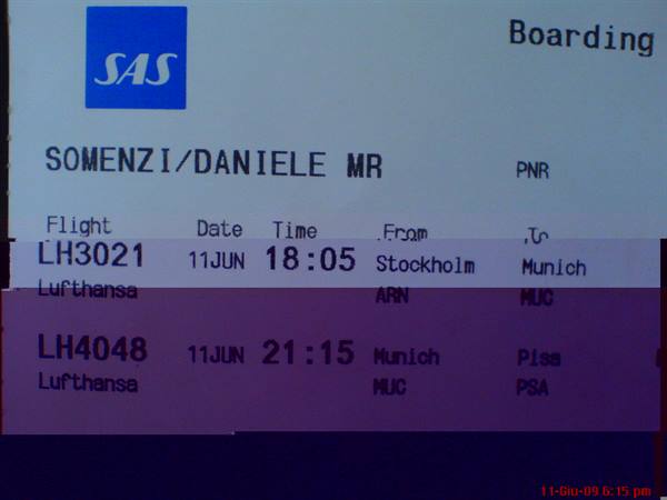 SAS boarding pass on screen, Lufthansa flights from Stockholm to Pisa via Munich