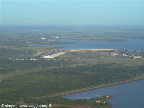 Itaipu Dam seen from above between river and forests