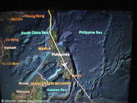Flight map screen showing airplane crossing the Philippines toward Manila