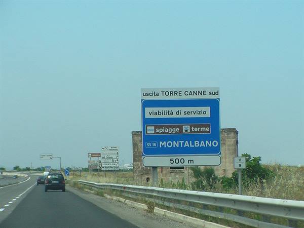 Blue highway sign indicates the Torre Canne exit at Montalbano
