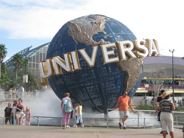 Tourists in front of the rotating Universal globe at Universal Studios Orlando