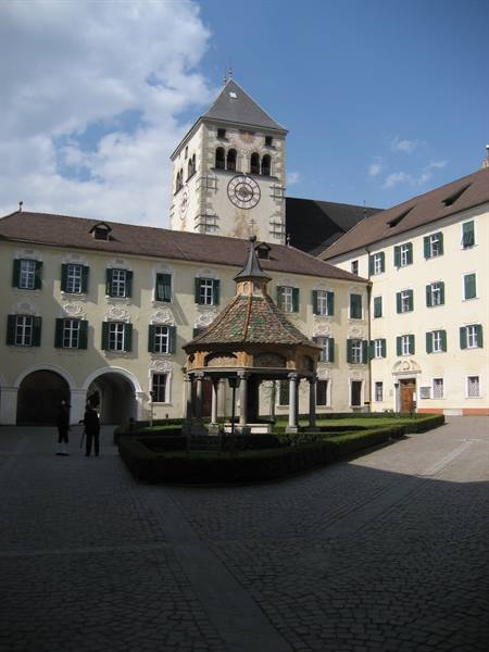 Neustift Abbey cloister with stone gazebo and painted bell tower