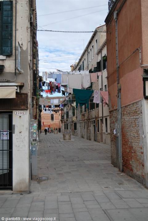 Courtyard in Venice with laundry hanging between brick buildings